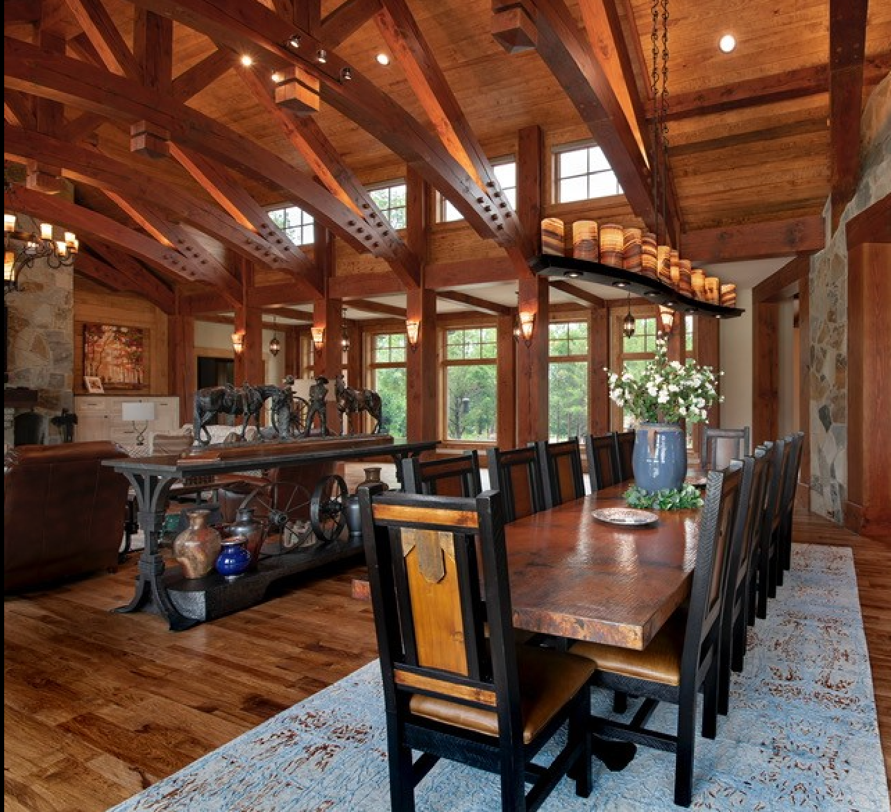 Dining room with custom table, equestrian art, and glowing stone fixture